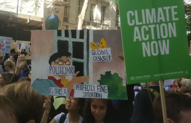 A protester holds up a poster