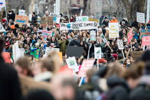 Protesters flood the streets of Montreal during a march for climate in March 2019