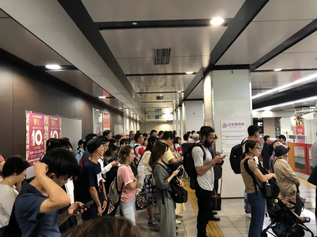 Queues at a Tokyo metro station