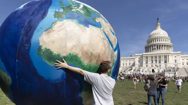 Climate protesters have also marched across Washington DC to the US Capitol building.