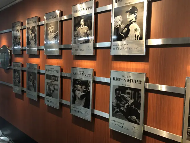 Pictures of baseball and football players on the wall