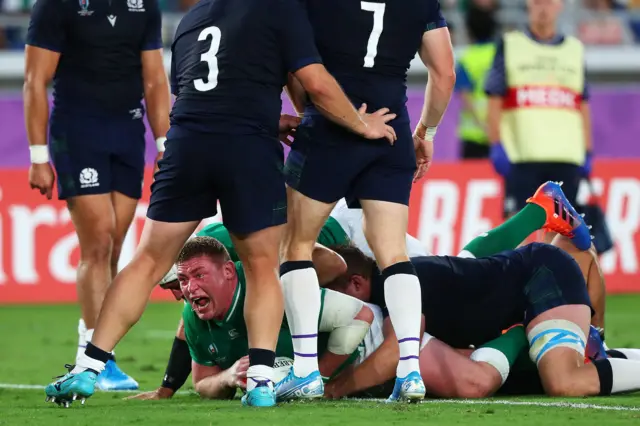 Tadhg Furlong celebrates scoring a try