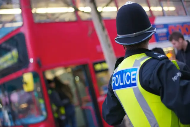 Police officer with bus