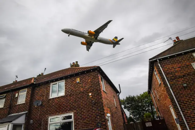 Thomas Cook plane over homes