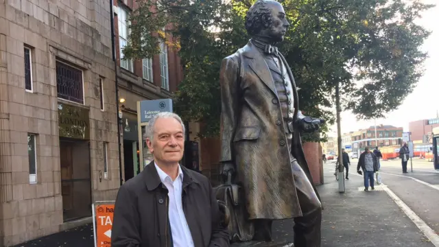 Ivor James by the Thomas Cook statue