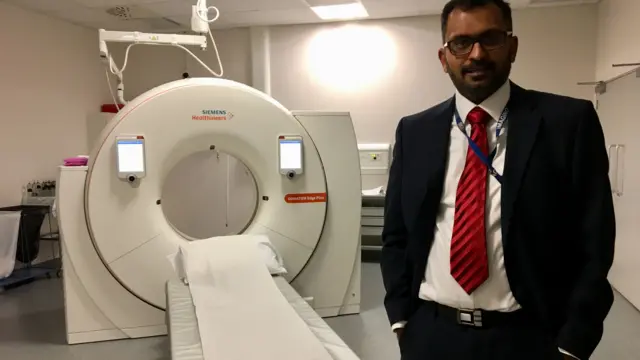 Dr Biju Thomas with the scanner