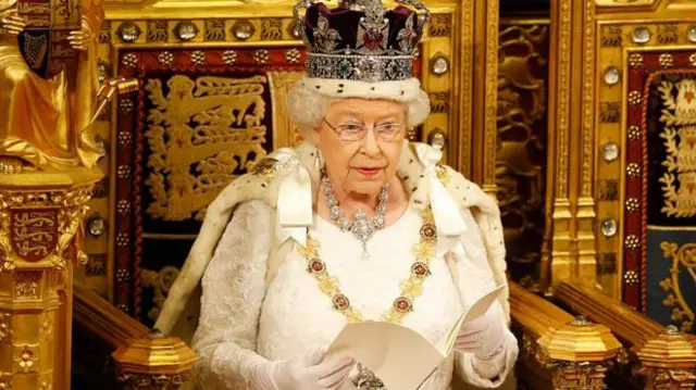 The Queen sitting on the throne in the House of Lords