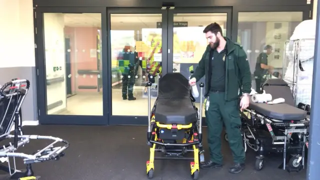 Paramedic with stretcher bed