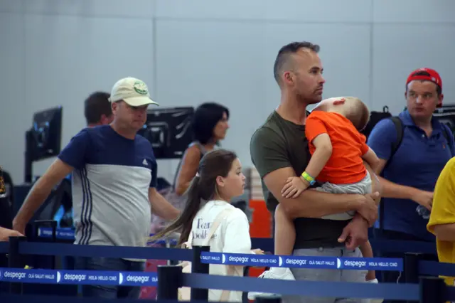 Passengers at Cancun airport in Mexico face a long journey home