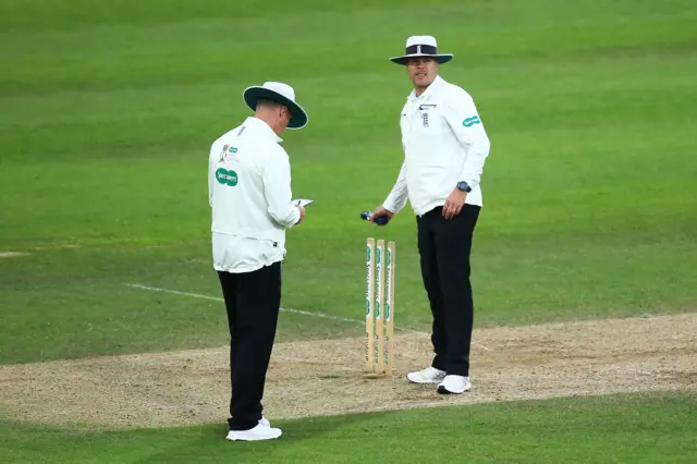 Umpires Chris Watts and Martin Saggers