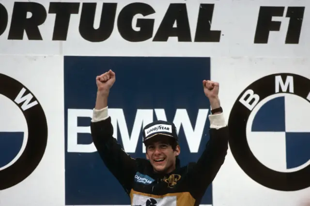 Ayrton Senna celebrates winning the Portugal Grand Prix at Estoril in 1985