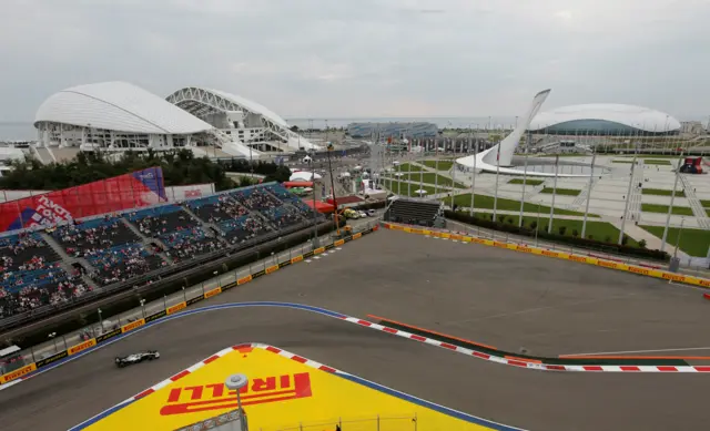 Lewis Hamilton on track during practice, with the Black Sea visible in the distance