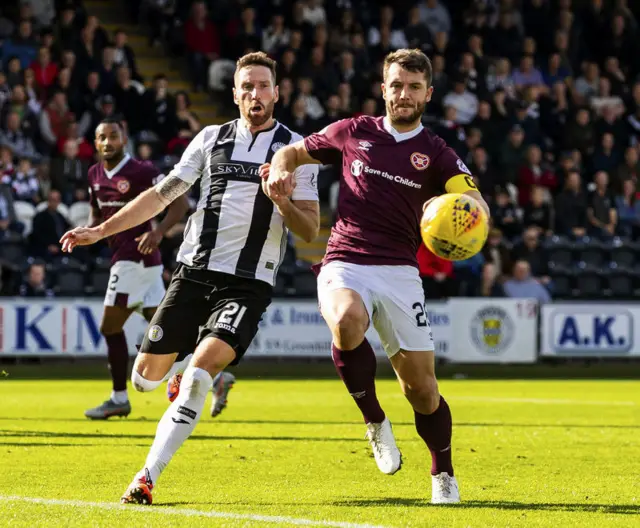 Kirk Broadfoot and Craig Halkett battle for the ball.