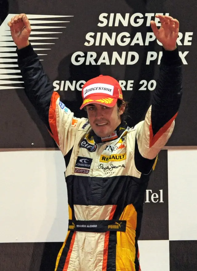 Fernando Alonso celebrates winning the Singapore Grand Prix in 2008