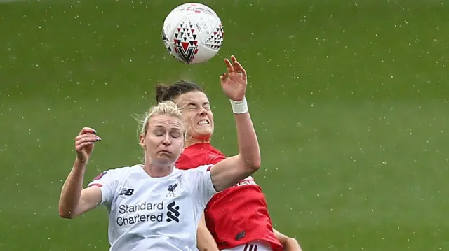 Rhiannon Roberts of Liverpool tussles with Manchester United's Jessica Sigsworth