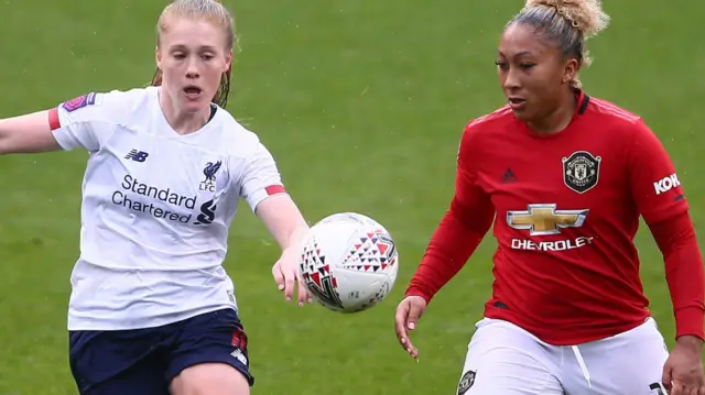 Amy Rodgers of Liverpool and Lauren James of Manchester United battle for possession