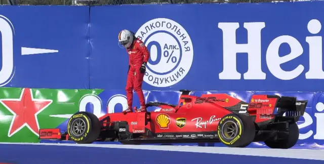 Sebastian Vettel steps out of his Ferrari