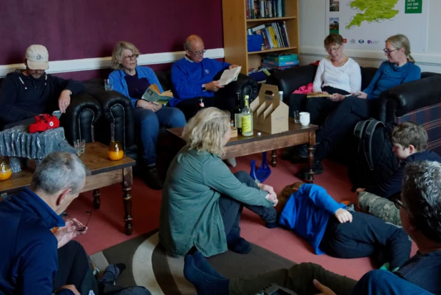 People listening to reading of Pigeon Post