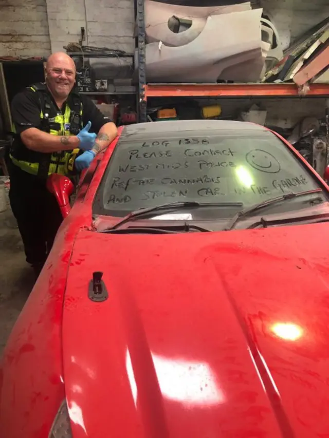 PC Andy Kitson with the car and message