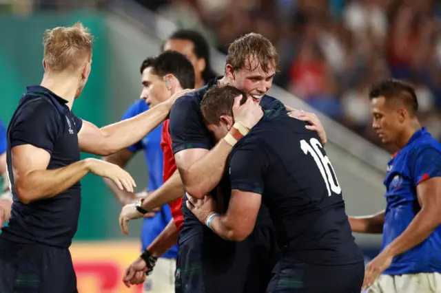 Jonny Gray embraces Fraser Brown at the full-time whistle in Kobe