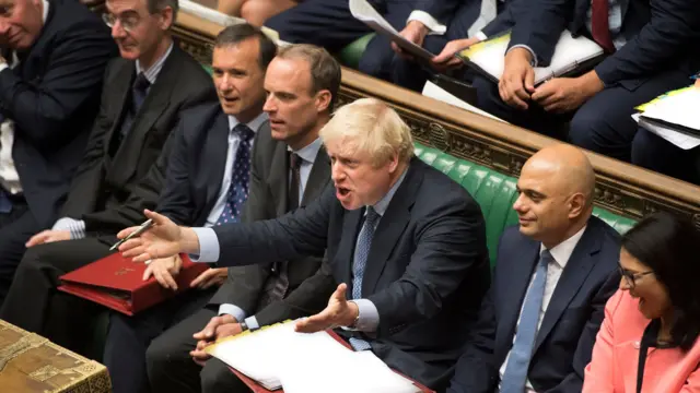 Prime Minister Boris Johnson gesticulates from the frontbenches