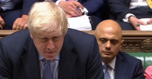 Javid sits behind Johnson sitting at the despatch box