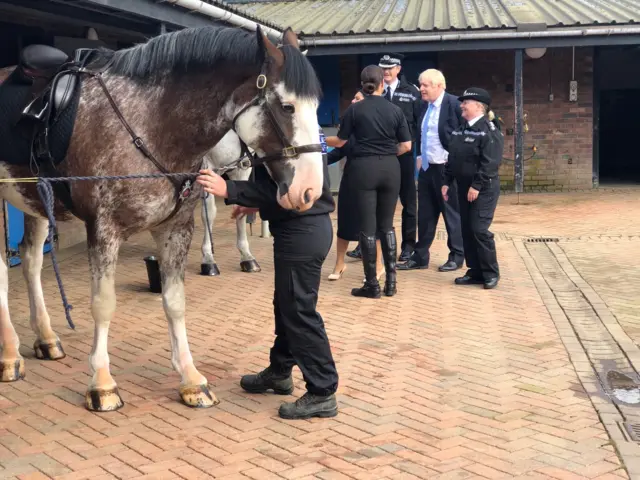 Boris Johnson is introduced to police horses in Wakefield