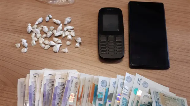 Two phones, drugs and cash