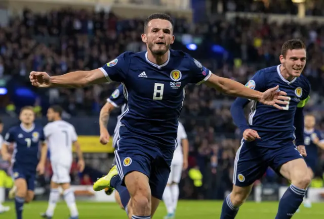 John McGinn celebrates the opening goal at Hampden