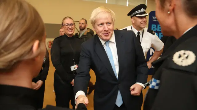 Boris Johnson meets an officer