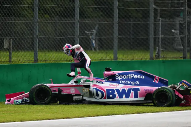 Sergio Perez jumps out of his car