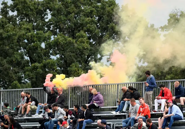 Ferrari fans set off red and yellow flares