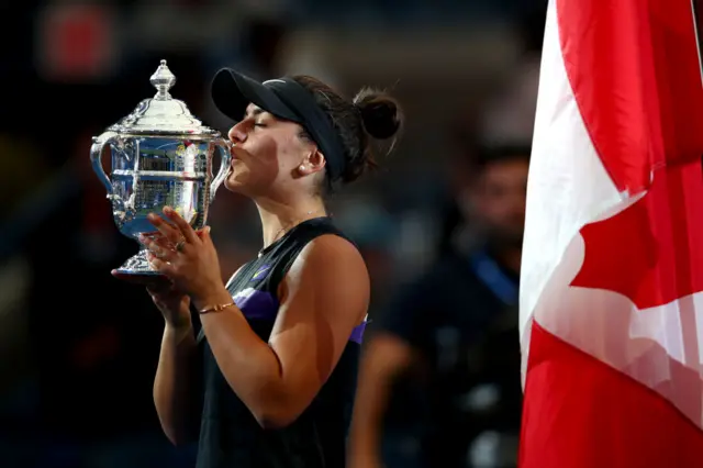 Bianca Andreescu kisses the US Open trophy