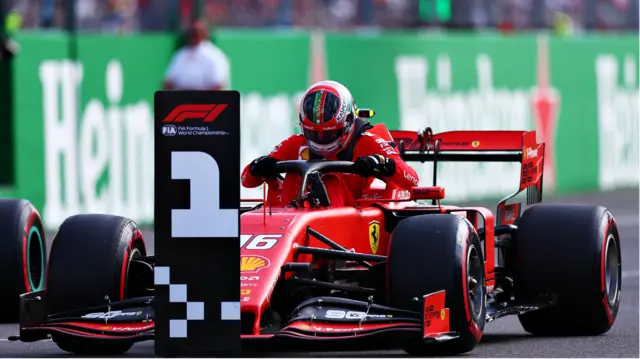 Charles Leclerc gets out of his Ferrari in the parc ferme