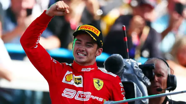 Charles Leclerc fist pump on the podium