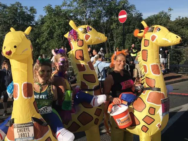 Runners dressed as giraffes