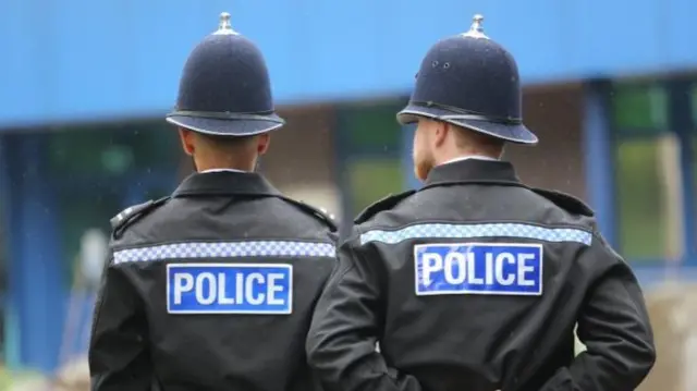 Back of two police officers