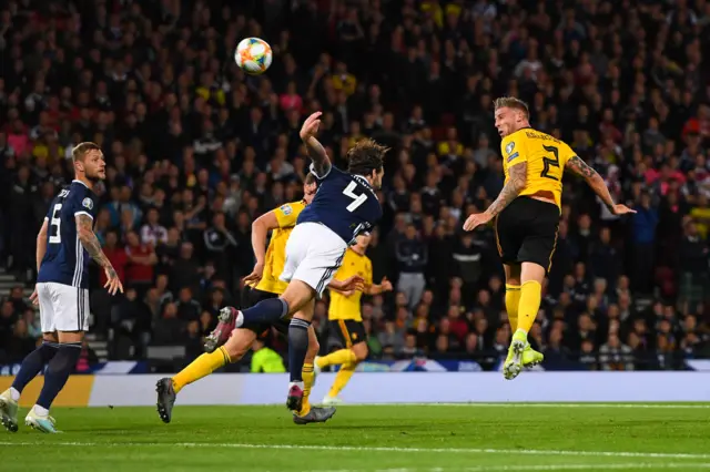 Toby Alderweireld rises to bullet a header past David Marshall for three...