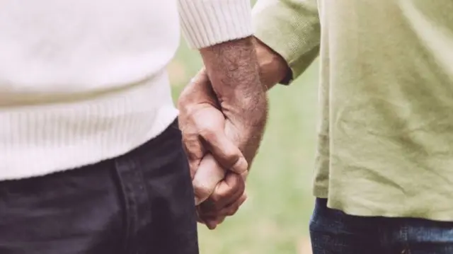 Men holding hands
