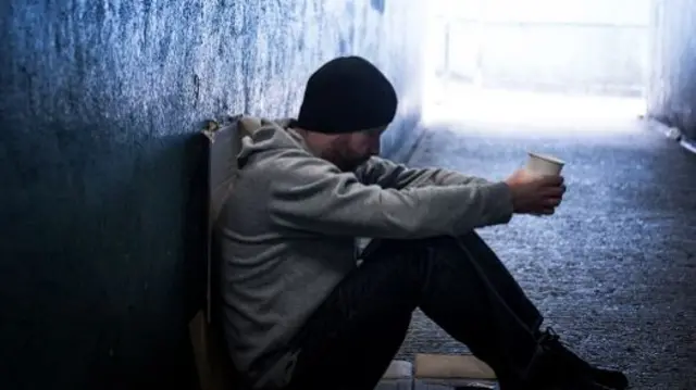 Man sat in tunnel begging