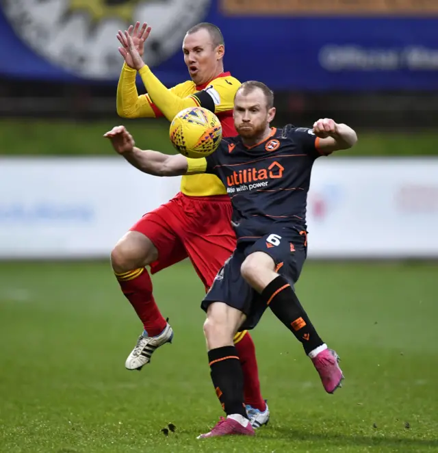 Partick Thistle's Kenny Miller and Dundee United's Mark Reynolds