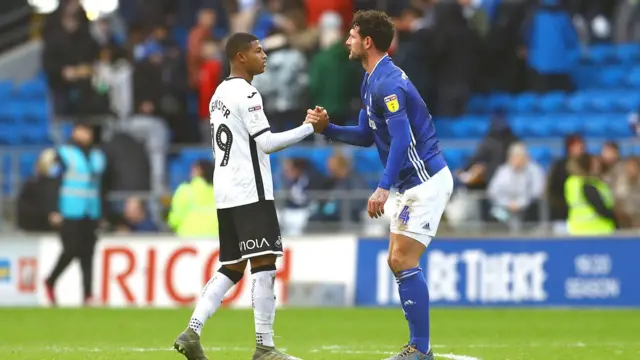 Brewster and Morrison shake hands at full time