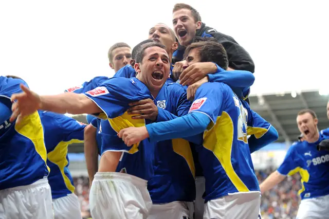 Michael Chopra and his Cardiff team-mates celebrate in 2013