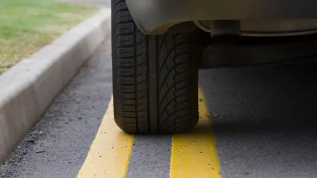 Car on yellow line