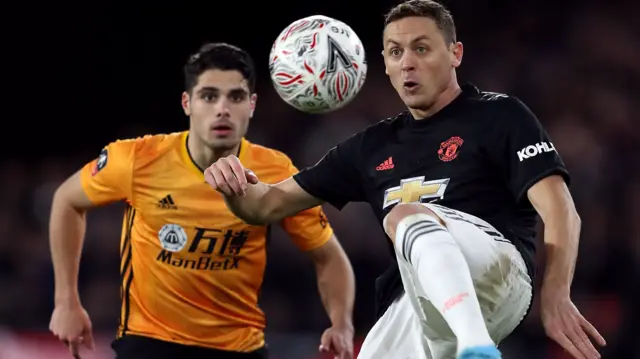 Wolverhampton Wanderers" Pedro Neto (left) and Manchester United"s Nemanja Matic in the previous FA Cup game