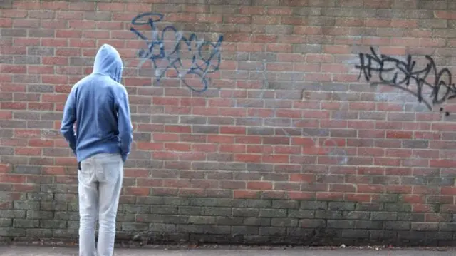 Young person and graffiti