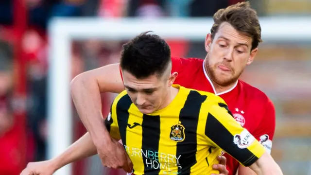 Dumbarton’s Ruaridh Langan and Aberdeen’s Ash Taylor