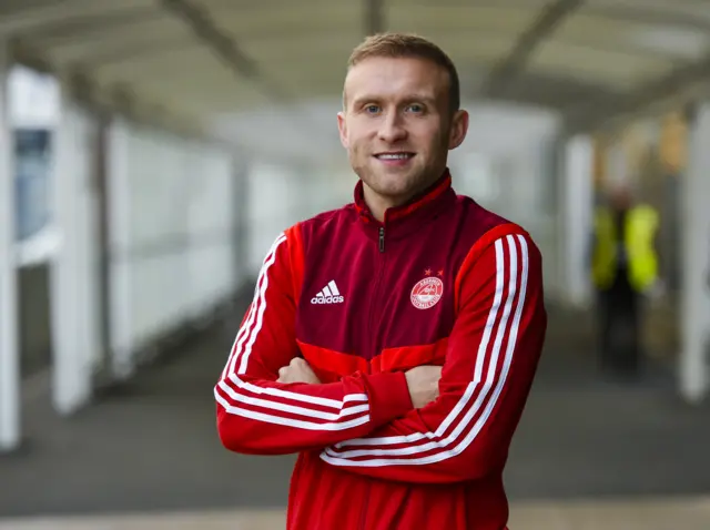 Aberdeen's Dylan McGeouch at Glasgow airport