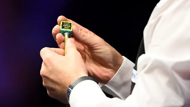 A player chalks his cue