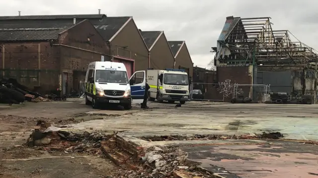 Police and army vehicles on the scene